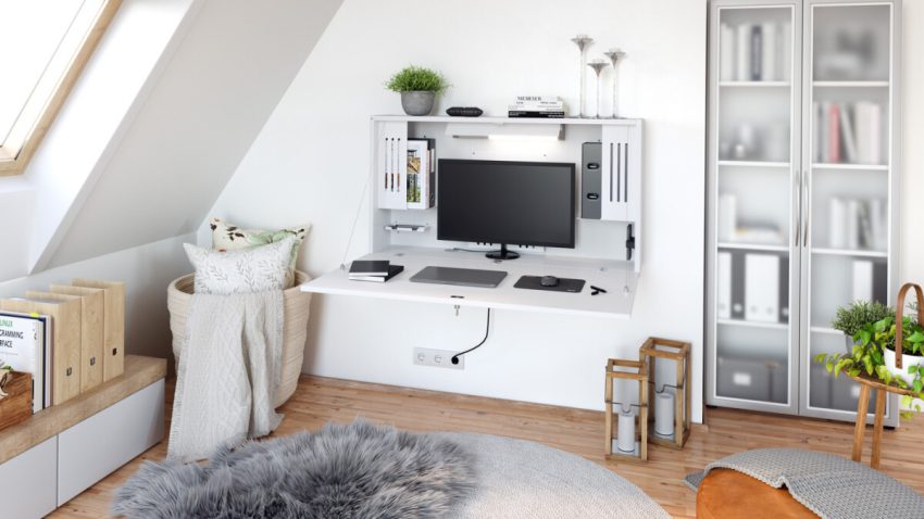 ^Das Bildzeigt einen Schribtisch der ohne Beine an der Wand befestigt ist und sich super platzsparend in den Raum integriert.
